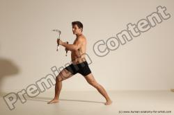 Underwear Fighting with axe Man White Muscular Short Brown Dynamic poses Academic